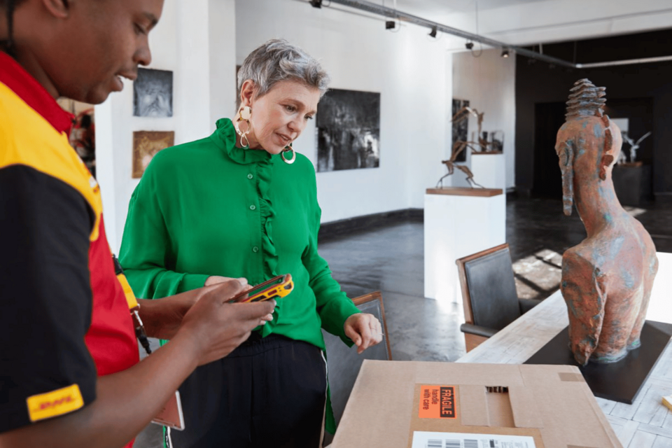 Sender and DHL courier with valuable goods